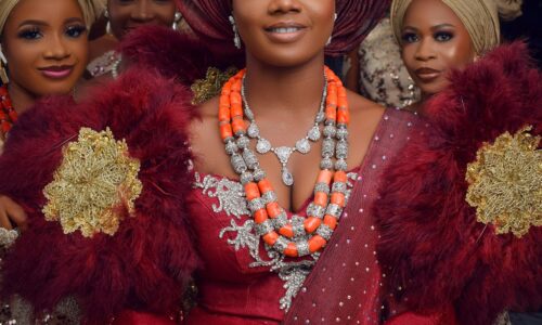 Nigerian bride and bridesmaids in traditional attire, featuring headwraps and elegant dresses.