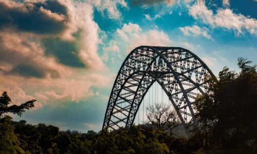 Stunning view of Adomi Bridge, Ghana with dramatic clouds in the backdrop, enhancing its architectural elegance.